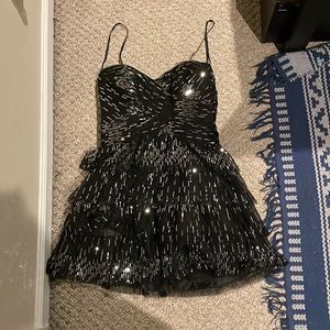 Black strapless layered sequined dress, perfect Taylor Swift Midnights look